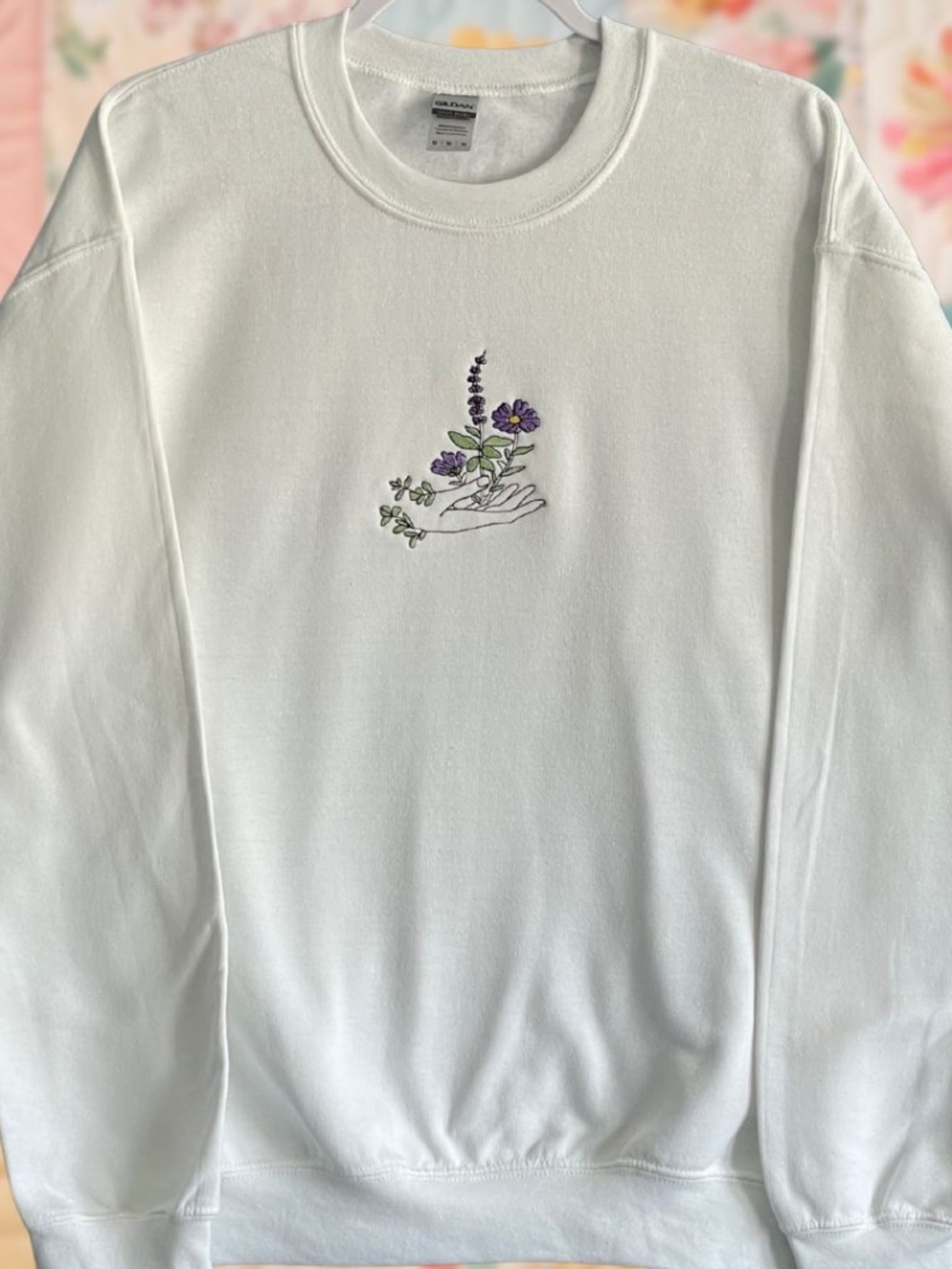 Embroidered Purple Flower Hand White Crewneck Sweatshirt